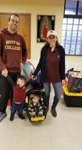 Dropping off adopt a family gifts with the family