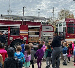 Students from Primrose School of Hudson visit with firefighters as part of Fire Prevention Month.